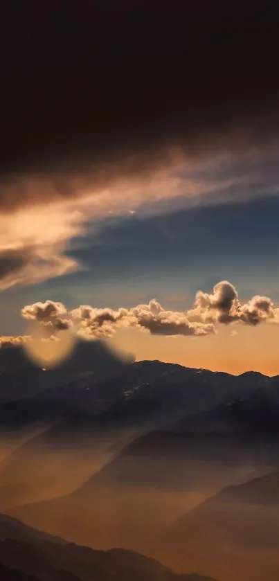 Scenic mountain landscape at sunset with vibrant orange and dark sky.