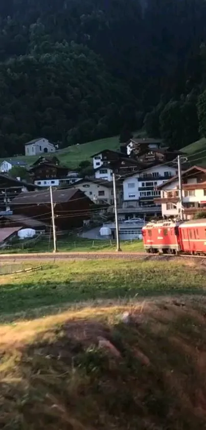 Red train passing through beautiful mountain village scenery.