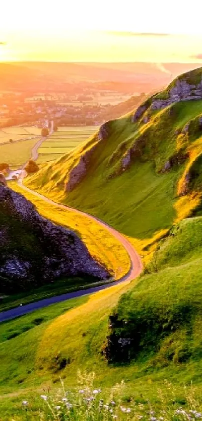 A vibrant sunset over a winding mountain road with lush green hills.