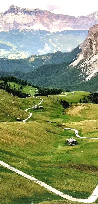 Scenic view of a winding path through a lush green mountain valley.