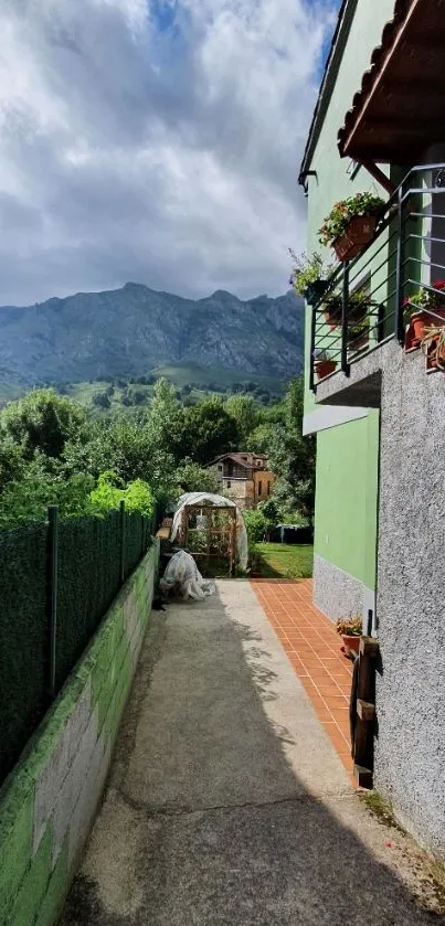 Scenic pathway with mountains and flowers.