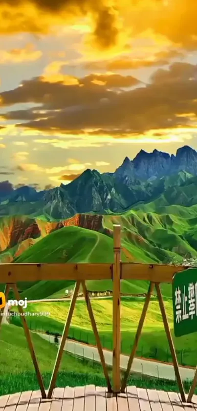 Scenic view of green hills and mountains under a golden sky.