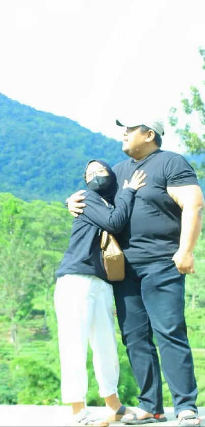 Couple embracing with mountain backdrop