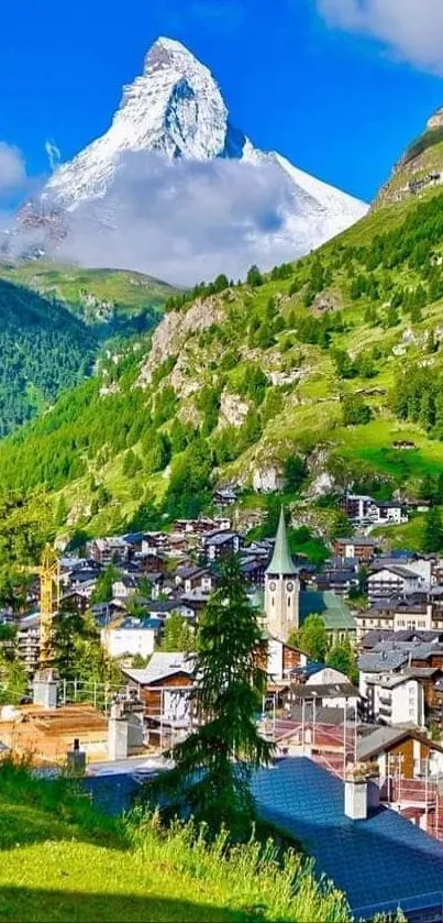 Mountain village with Matterhorn backdrop and lush green landscape.