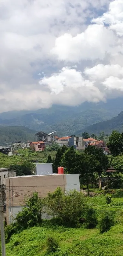 Serene mountain view from a window with lush greenery and cloudy sky.