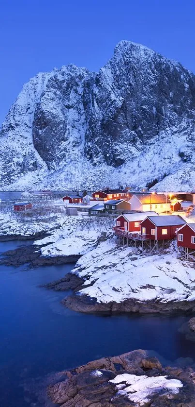 Snowy mountain and cozy cabins by a blue lake at dusk.