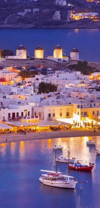 Mykonos harbor at night with windmills.