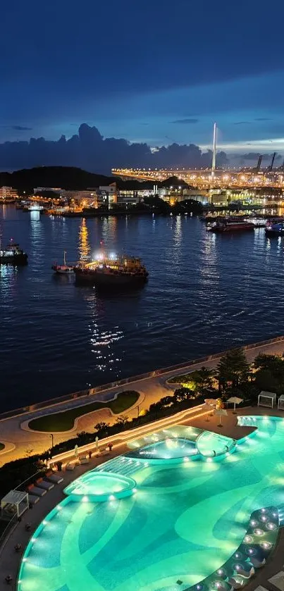 A serene night harbor view with city lights and illuminated water in the foreground.