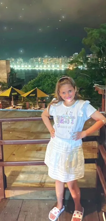 Girl on balcony with nighttime city view and starry sky.