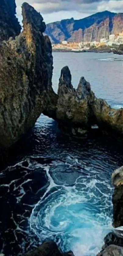 Scenic ocean view with towering rock formations and surf.