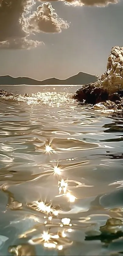 Serene ocean landscape with sunset reflecting on water.