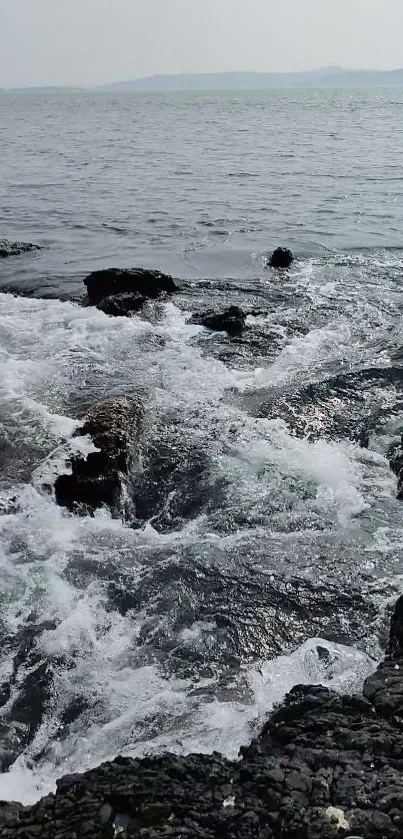 A rocky shoreline with crashing ocean waves.