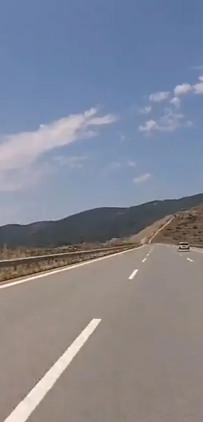 Open highway under a clear blue sky landscape.