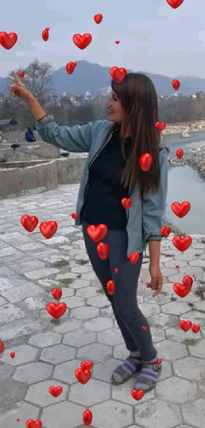 Young woman enjoying a scenic outdoor view by the river.