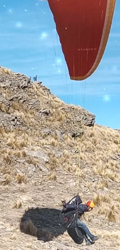 Paraglider soaring over rocky terrain with a bright blue sky backdrop.