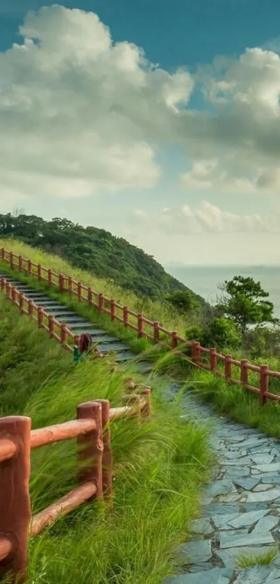 Scenic pathway leading to the sea under a blue sky.