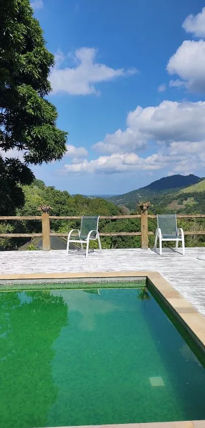 Scenic view of a pool and mountains under a blue sky.