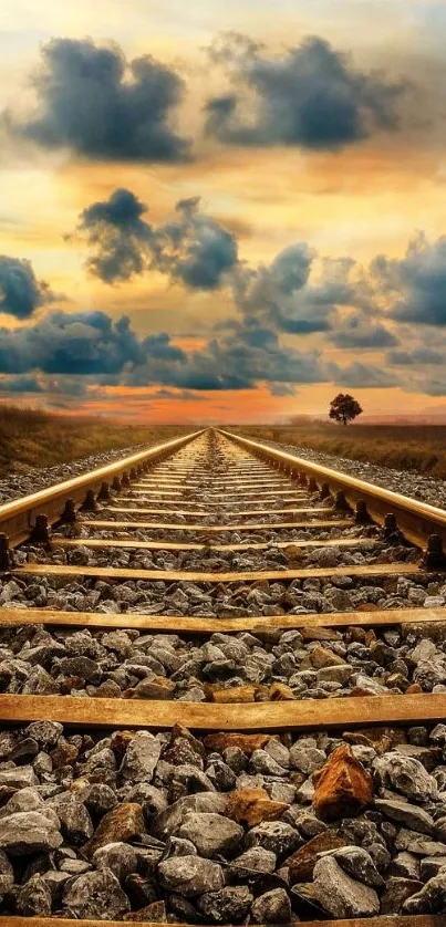 Scenic railway track at sunset with vibrant sky and clouds.