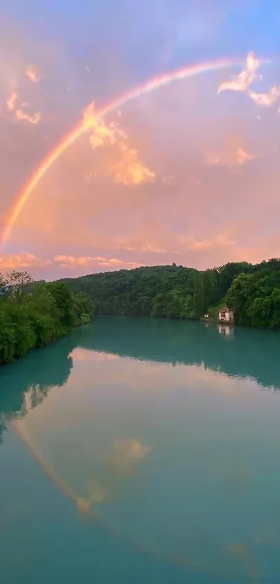 Rainbow arcs over a calm lake with scenic greenery.