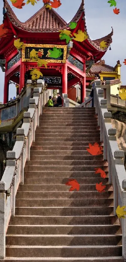 Red-roofed temple atop stairs with lion statues.