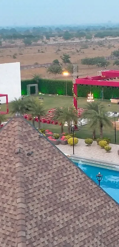 Aerial view of a scenic resort with pool and colorful decorations.