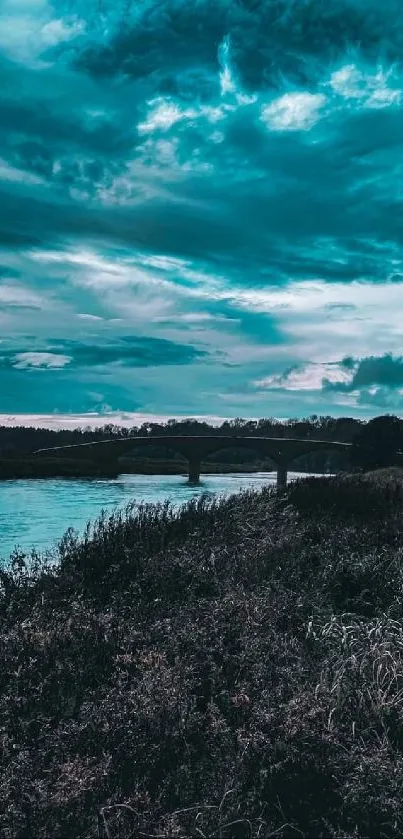 A scenic river view with bridge under dramatic teal blue sky