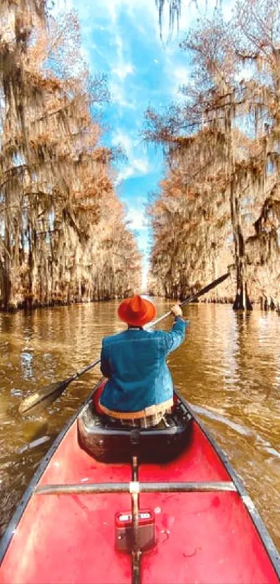 Person canoeing on a scenic autumn river.