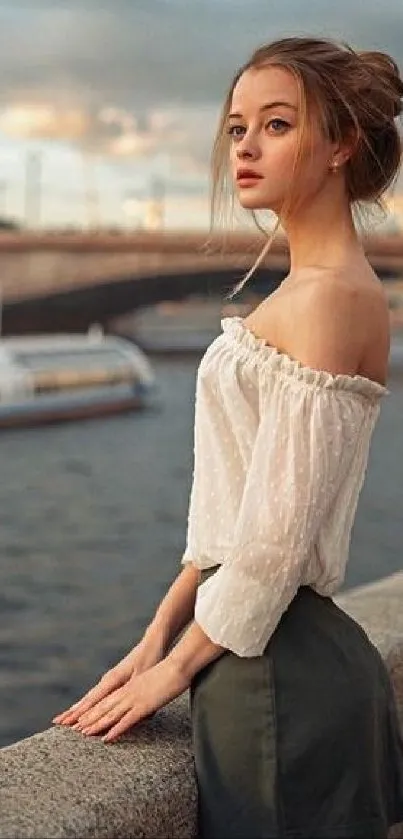 Woman by river in scenic evening setting.