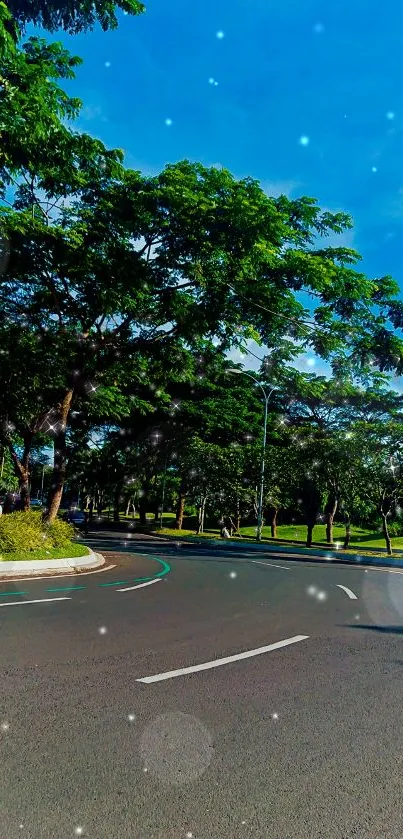 Scenic road under a vibrant blue sky with lush green trees.