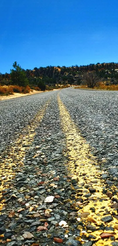 Vibrant road under a bright blue sky, perfect for inspiring travel adventures.