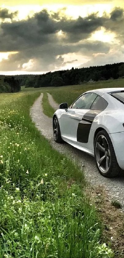 White sports car on scenic green road under a dramatic sky.