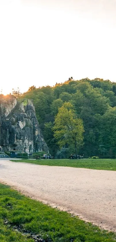 Serene path through rocky formations and lush green forest.