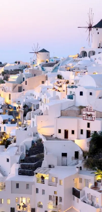 Santorini skyline with white buildings at sunset.