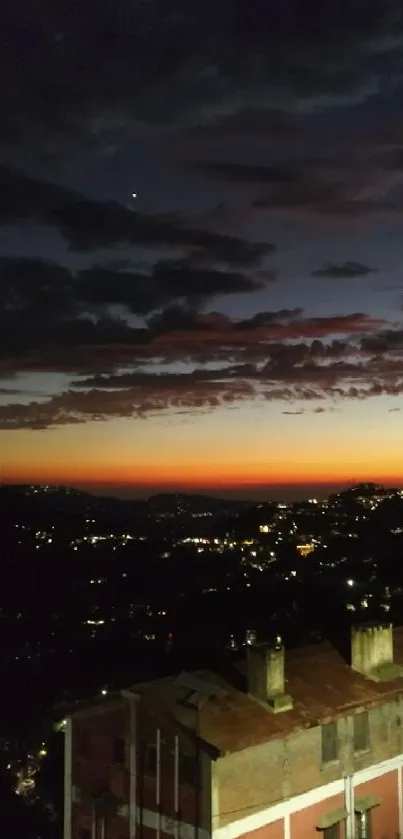 Shimla city nightscape with glowing sunset sky.