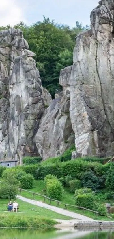 Towering stone formations with lush greenery and a serene lake reflection.