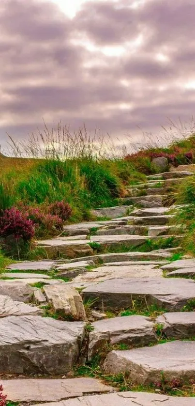 Stone path through green landscape under a purple sky.