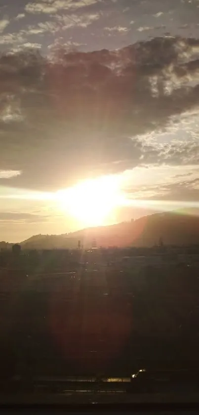 Sunset view through a window with dramatic sky hues.