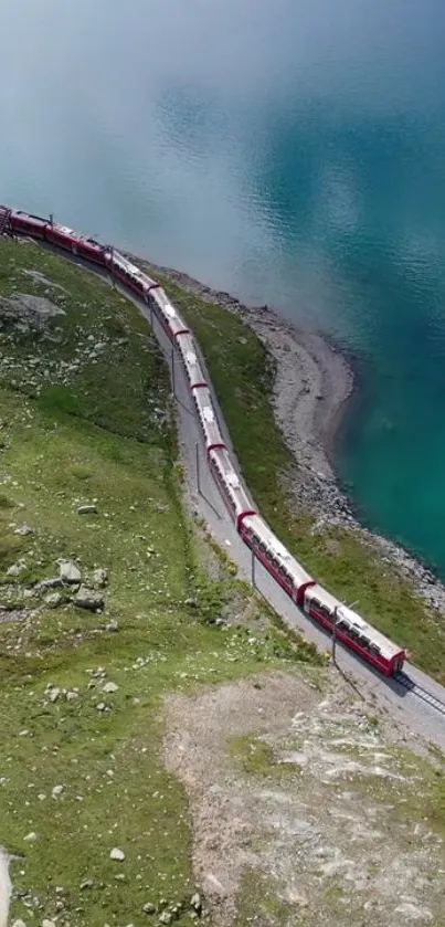 Train by an aqua blue lake amidst green hills.