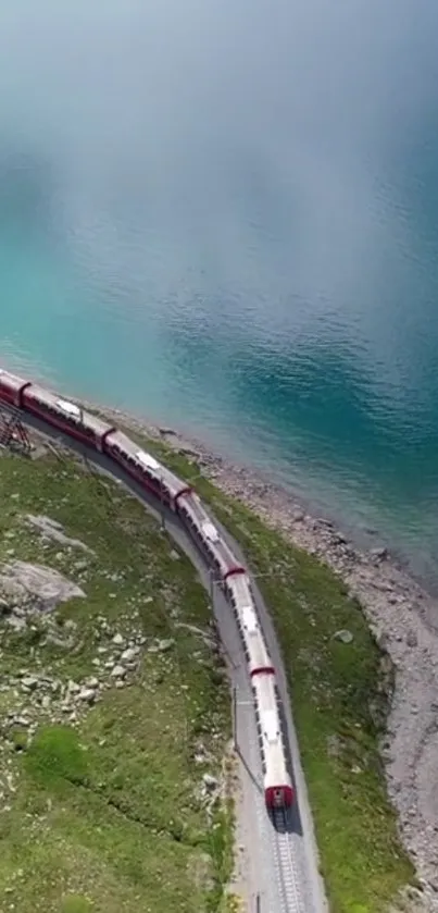 Scenic train passing by azure waters and lush green landscape.