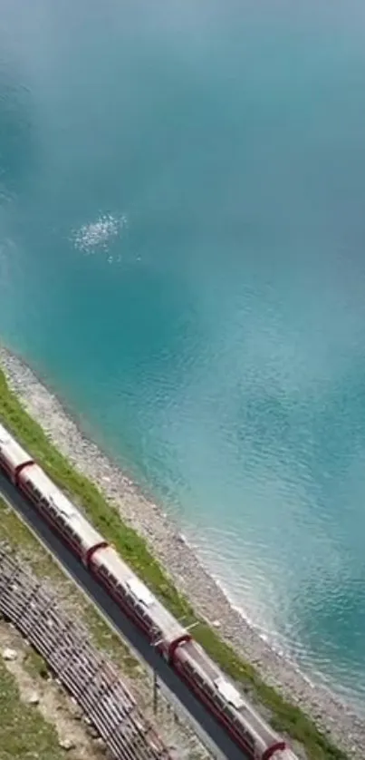 A train by turquoise blue water and lush greenery.