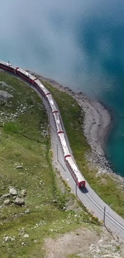 Train traveling along a turquoise lake with lush greenery.