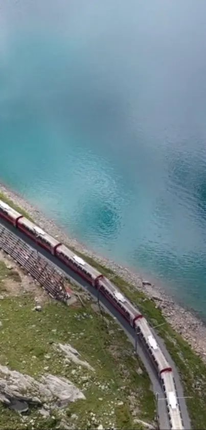 A scenic train travels along a turquoise mountain lake, offering breathtaking views.