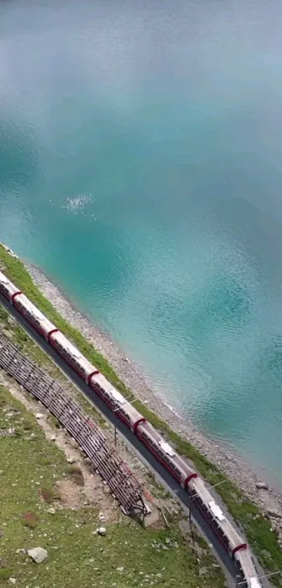 Scenic train journey beside a turquoise lake with vibrant natural beauty.