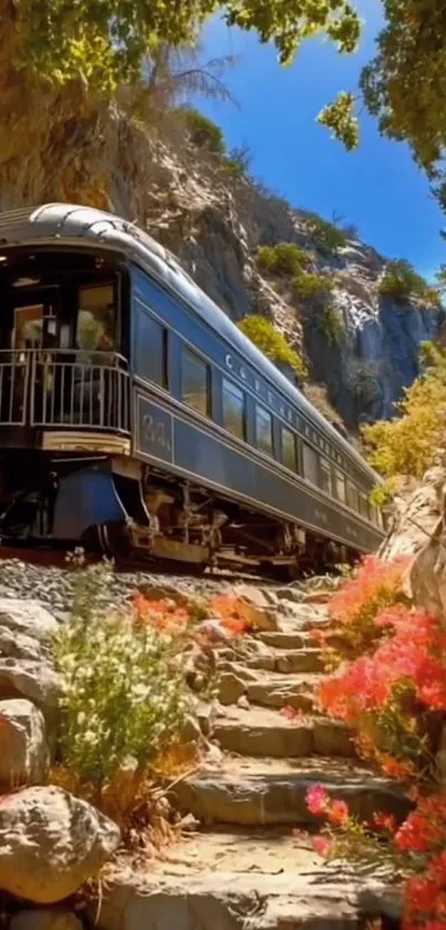 Train passing through rocky landscape with vibrant flowers.