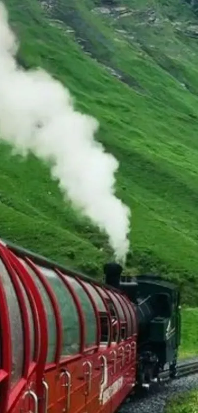 Red train travels through lush green mountain landscape.