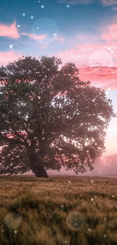 Lonely tree in a sunset landscape with vibrant pink skies and lush green fields.