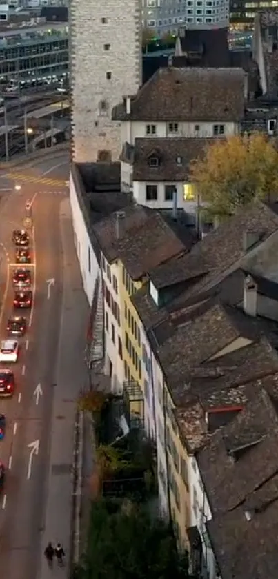 Scenic urban street with historic architecture and evening traffic.