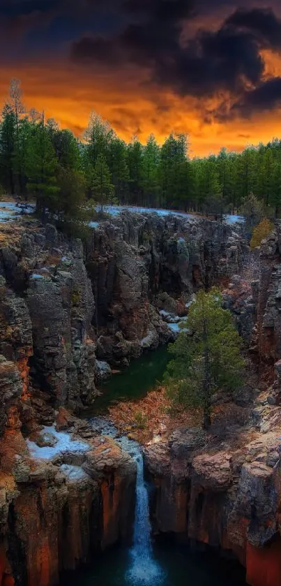 Stunning mobile wallpaper of a waterfall at sunset in a rocky canyon.