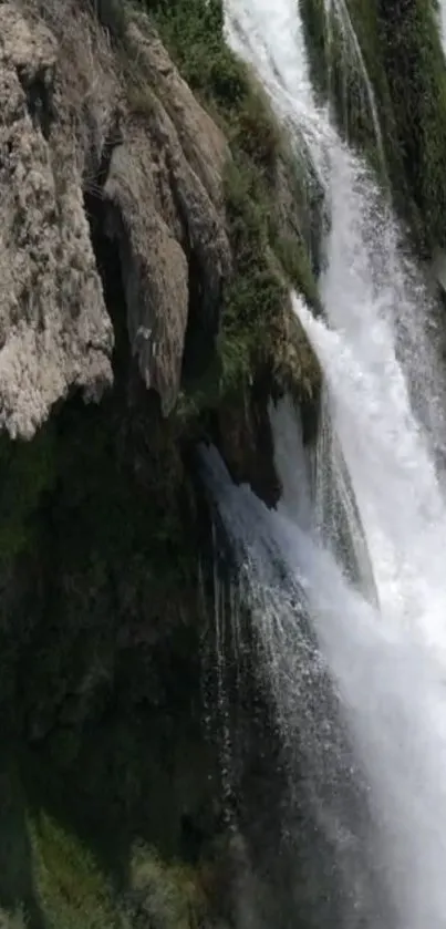 Scenic waterfall cascading over lush cliffs.