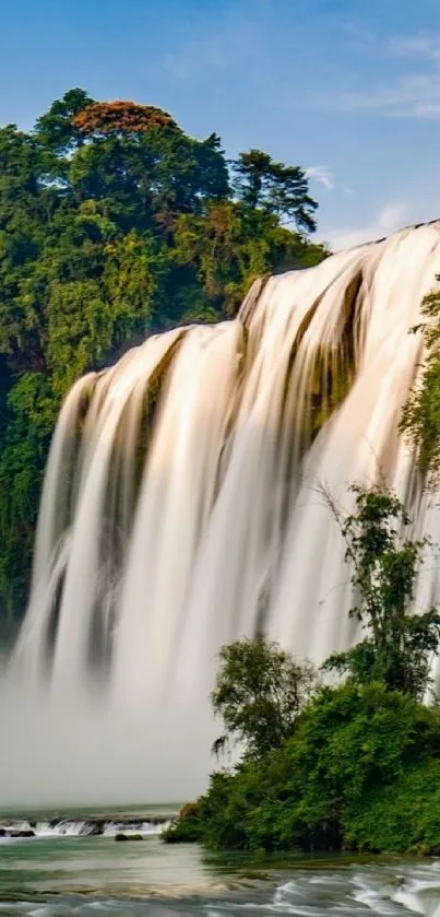 Breathtaking waterfall amidst lush greenery, perfect for mobile wallpaper.